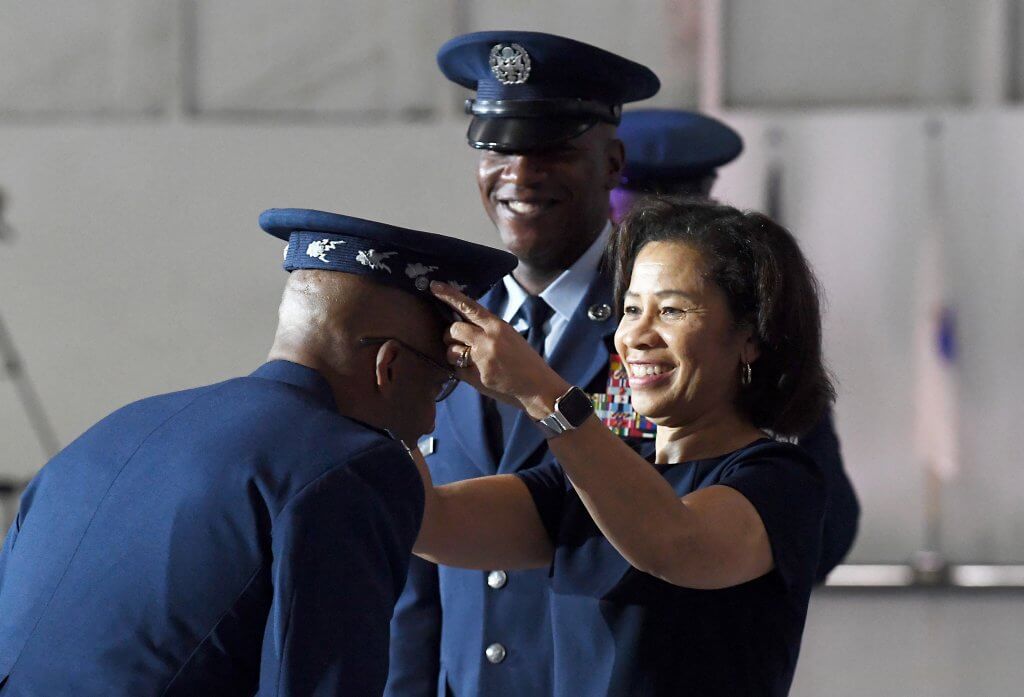 Sharene Brown presents the official Air Force Chief of Staff service cap to her husband during the CSAF transition ceremony at Joint Base Andrews in 2020. Photo by Staff Sgt. Chad Trujillo.