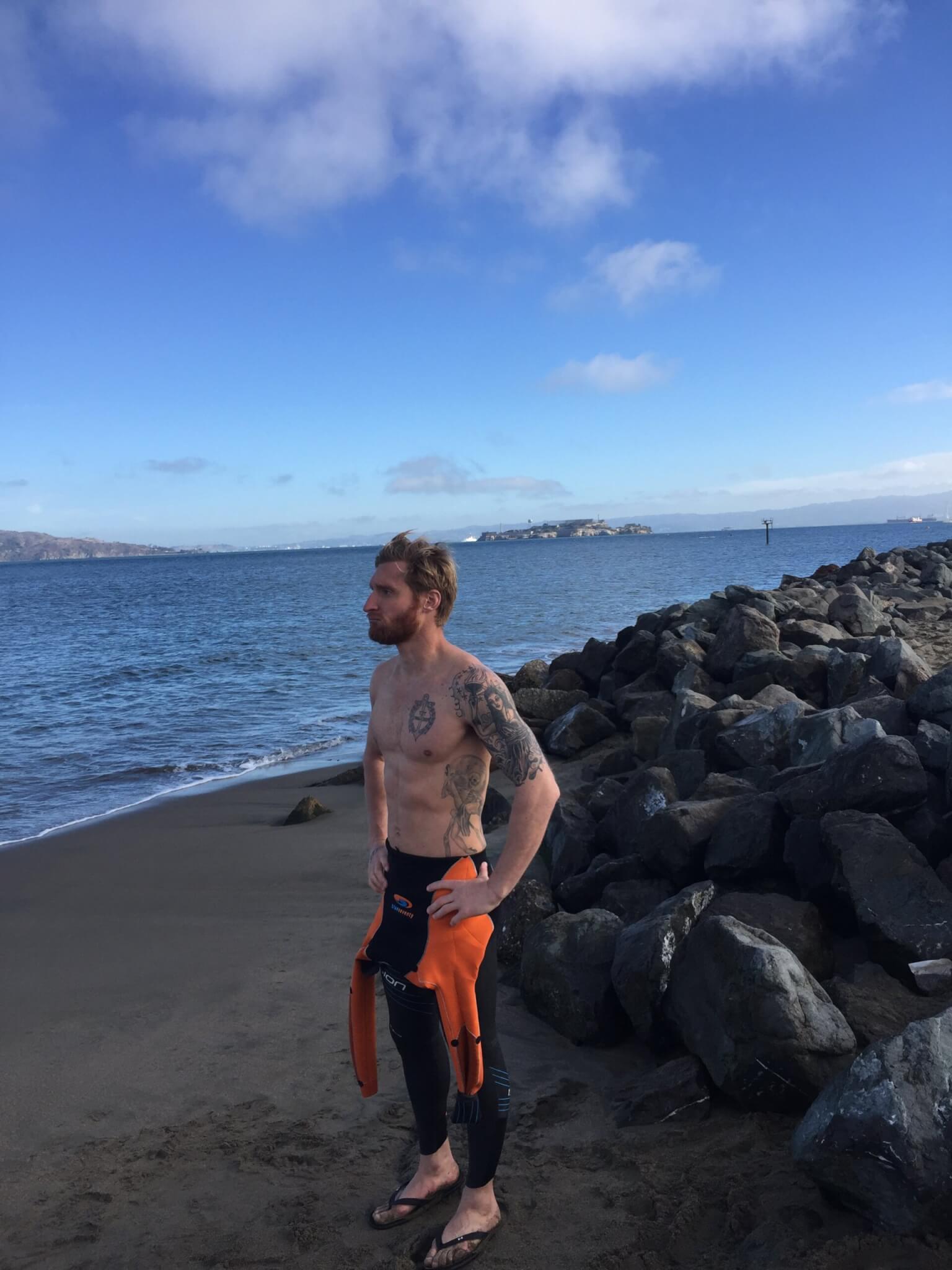 Paralympian and U.S. Naval Academy graduate Brad Snyder stands on the beach after an open-water training session. Snyder has stepped into an informal leadership training role at the Naval Academy. Photo credit: Courtesy photo Brad Snyder