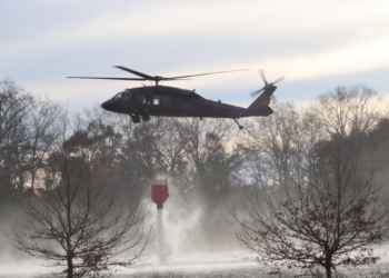 Soldiers with Company A, 111th General Support Aviation Battalion, 59 Aviation Troop Command, South Carolina National Guard prepare two Blackhawk Helicopters to assist the South Carolina Forestry Commission and the South Carolina Department of Natural Resources with wildfire containment in Horry County, South Carolina, March 2, 2025. The Blackhawk water buckets for this mission can carry approximately 600 gallons of water. (U.S. Army Photo by Sgt. Elizabeth A. Schneider, South Carolina National Guard)