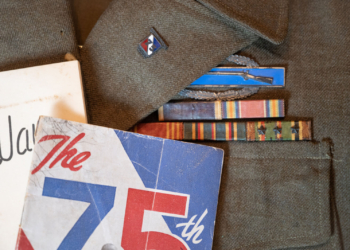 World War II veteran Vernon Brantley's military ribbons and Combat Infantryman Badge on his old uniform.