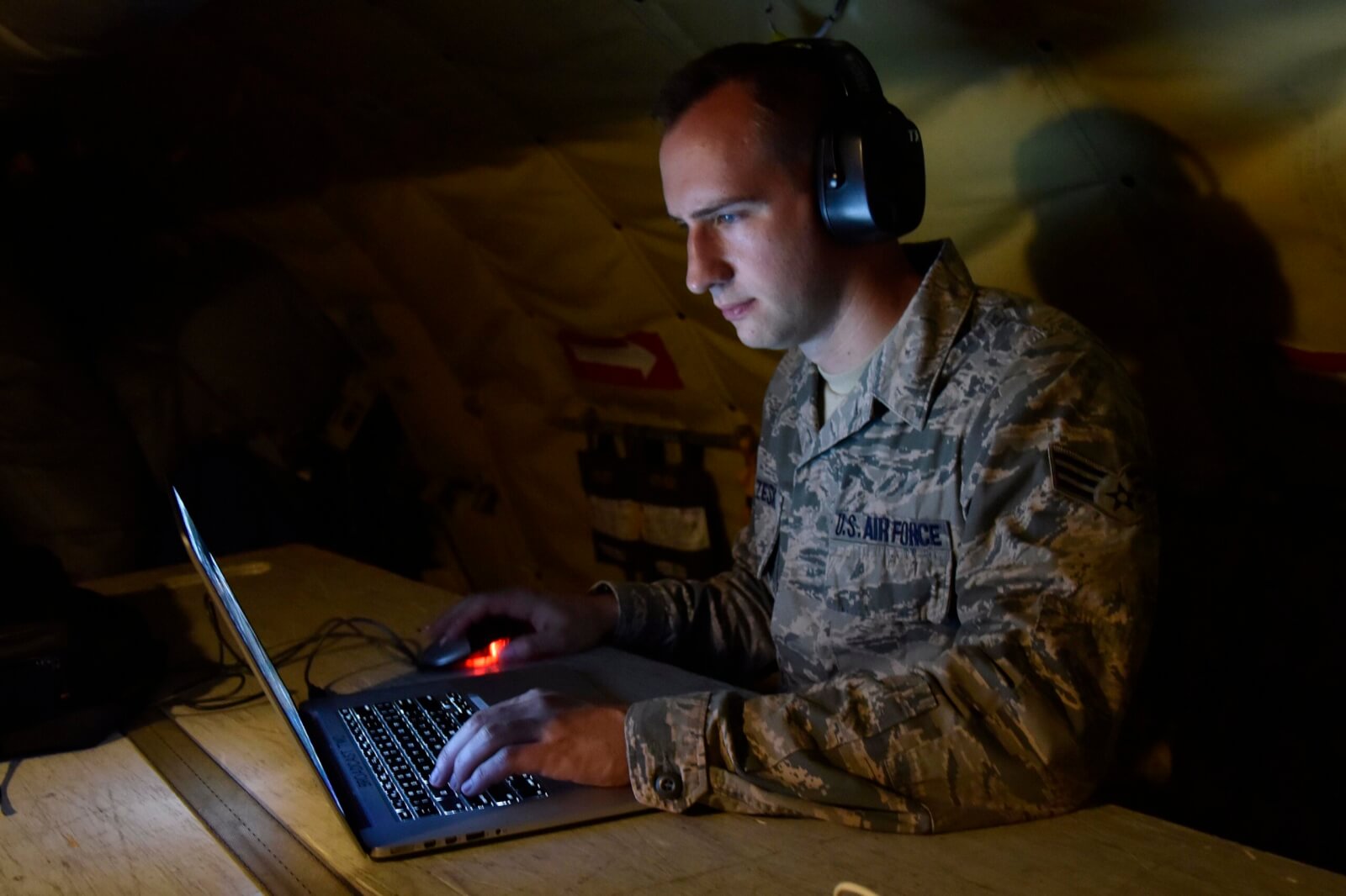 Senior Airman Ryan Zeski utilized time during a long flight as a passenger on a Michigan Air National Guard KC-135 Stratotanker to work on some homework for a course he was taking at Oakland University in in 2018. Photo by Tech. Sgt. Dan Heaton. 