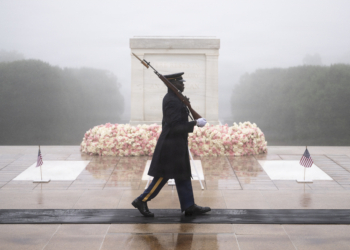 A tomb guard from the 3d U.S. Infantry Regiment (The Old Guard) walks the mat at the Tomb of the Unknown Soldier at Arlington National Cemetery. U.S. Army photo by Elizabeth Fraser / Arlington National Cemetery.