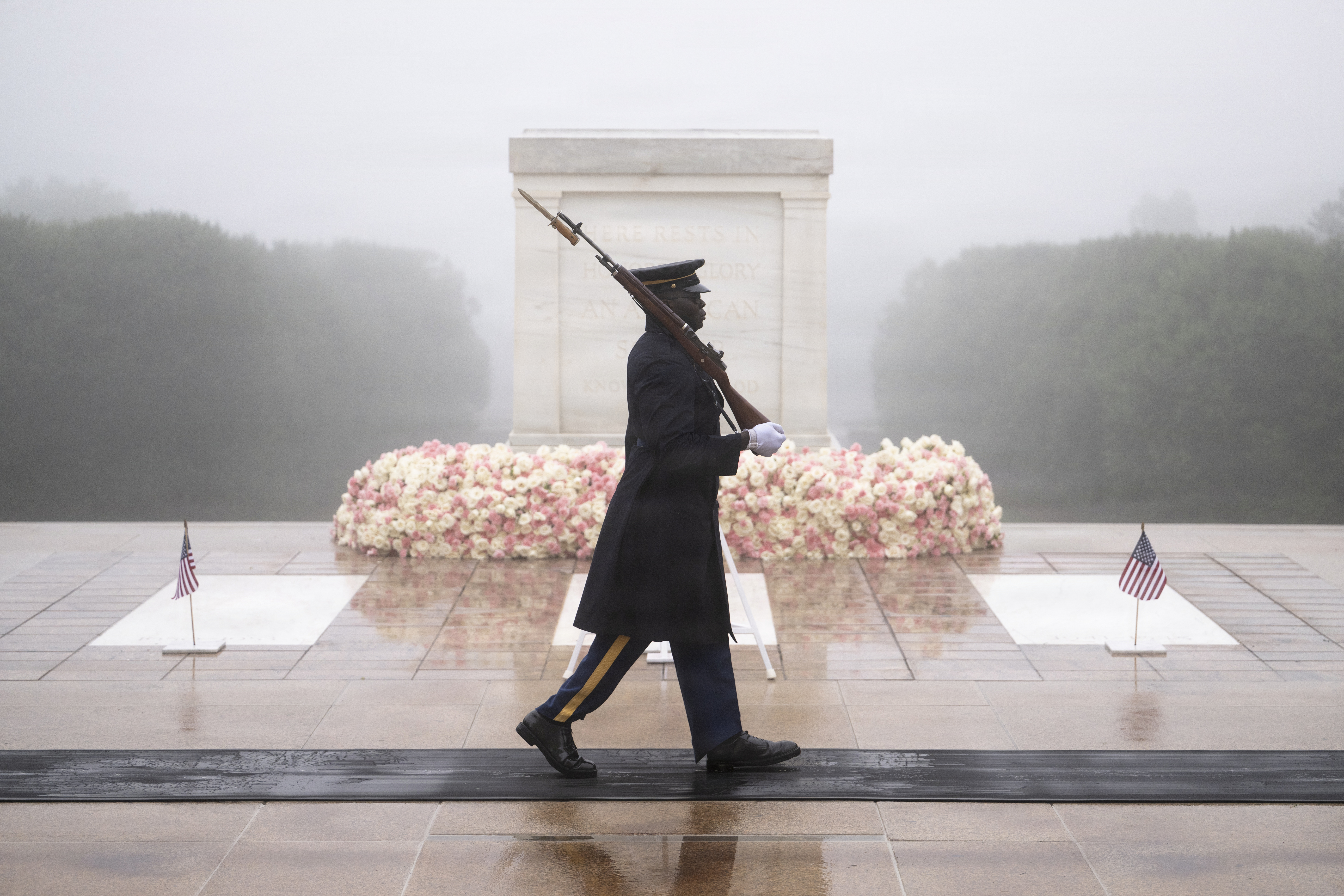 A tomb guard from the 3d U.S. Infantry Regiment (The Old Guard) walks the mat at the Tomb of the Unknown Soldier at Arlington National Cemetery. U.S. Army photo by Elizabeth Fraser / Arlington National Cemetery.